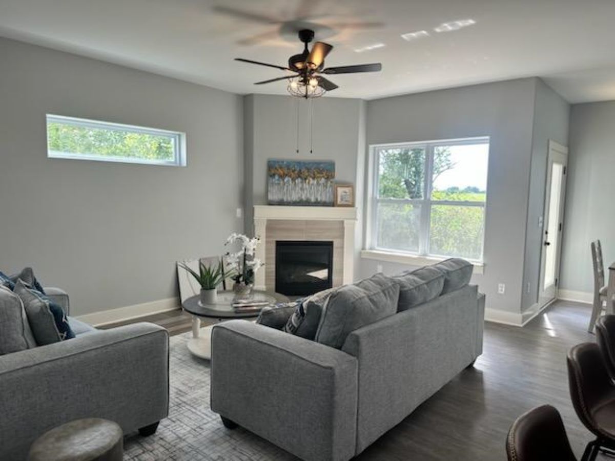 634 Anjali Court, Unit R Sycamore, IL 60178 - Photo 6 of 20 a living room with furniture and a fireplace