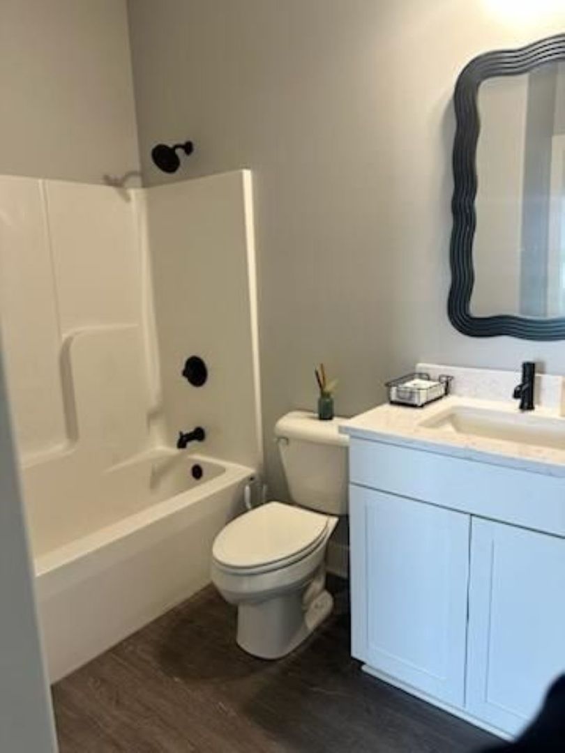 634 Anjali Court, Unit R Sycamore, IL 60178 - Photo 10 of 20 a bathroom with a sink toilet and shower