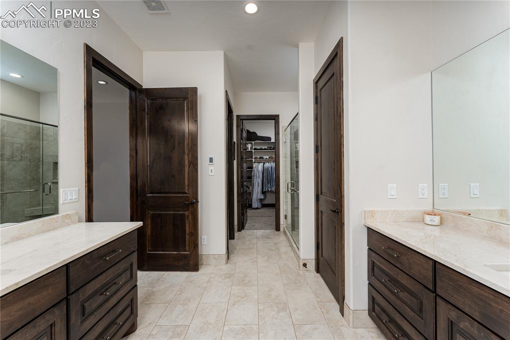9775 Walker Road Colorado Springs, CO 80908 - Photo 14 of 50 a bathroom with a sink and a mirror