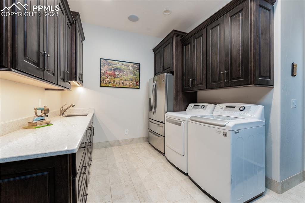 9775 Walker Road Colorado Springs, CO 80908 - Photo 19 of 50 a utility room with dryer and washer