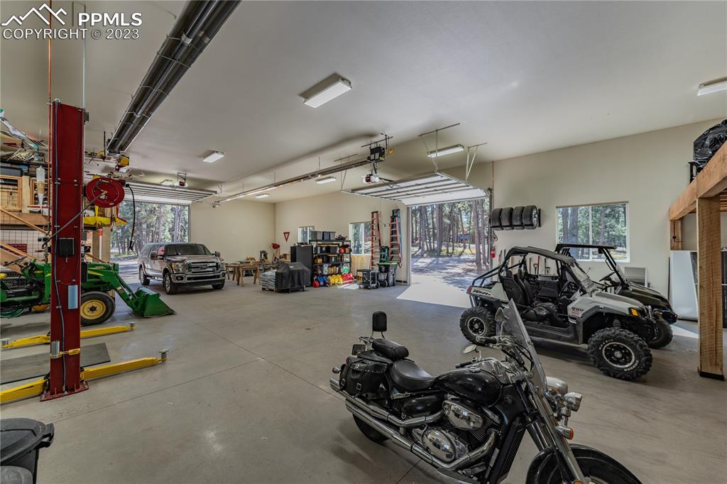 9775 Walker Road Colorado Springs, CO 80908 - Photo 23 of 50 a room with gym equipment and a large window