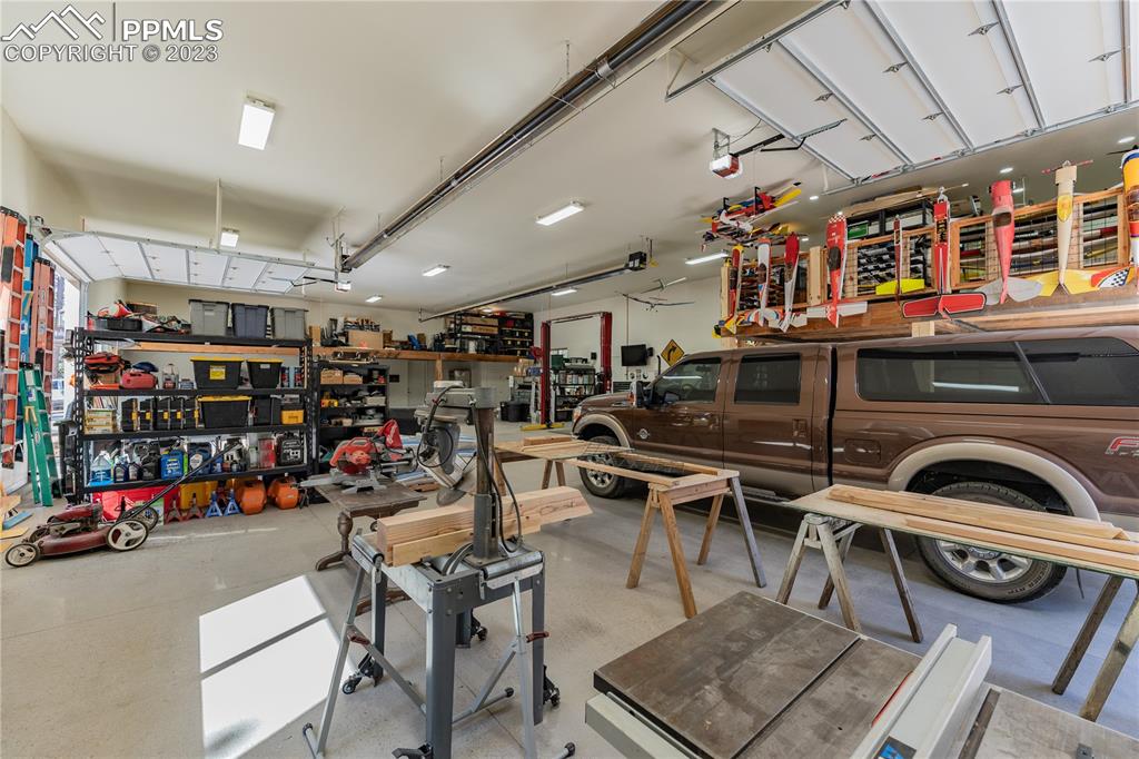 9775 Walker Road Colorado Springs, CO 80908 - Photo 29 of 50 a view of a garage with lots of stuff