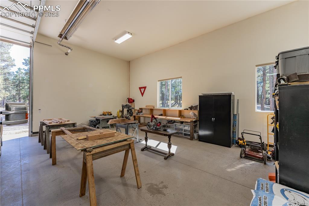 9775 Walker Road Colorado Springs, CO 80908 - Photo 30 of 50 a livingroom with workspace and a window