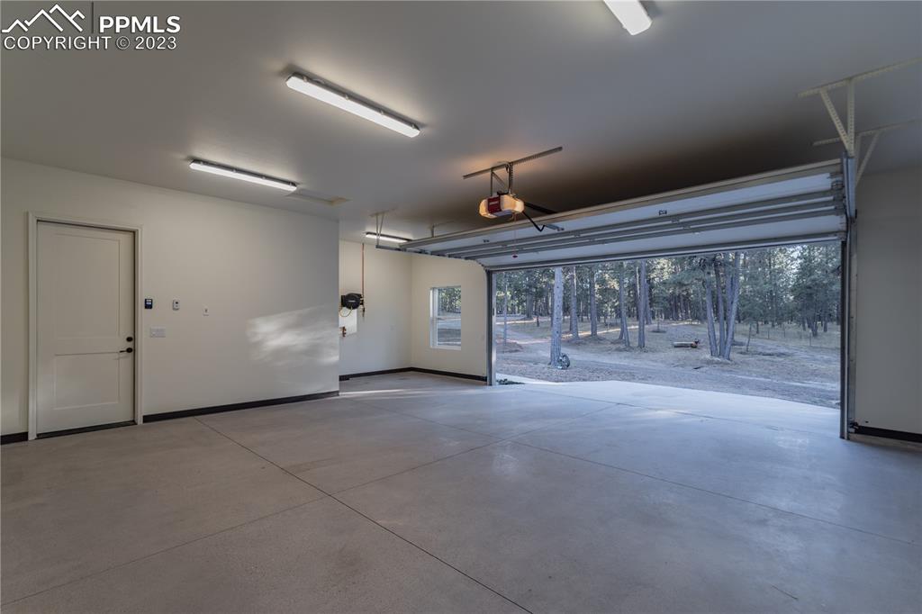9775 Walker Road Colorado Springs, CO 80908 - Photo 32 of 50 a view of a room with an empty space and a fireplace