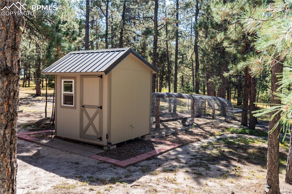 9775 Walker Road Colorado Springs, CO 80908 - Photo 48 of 50 a view of a house with a yard