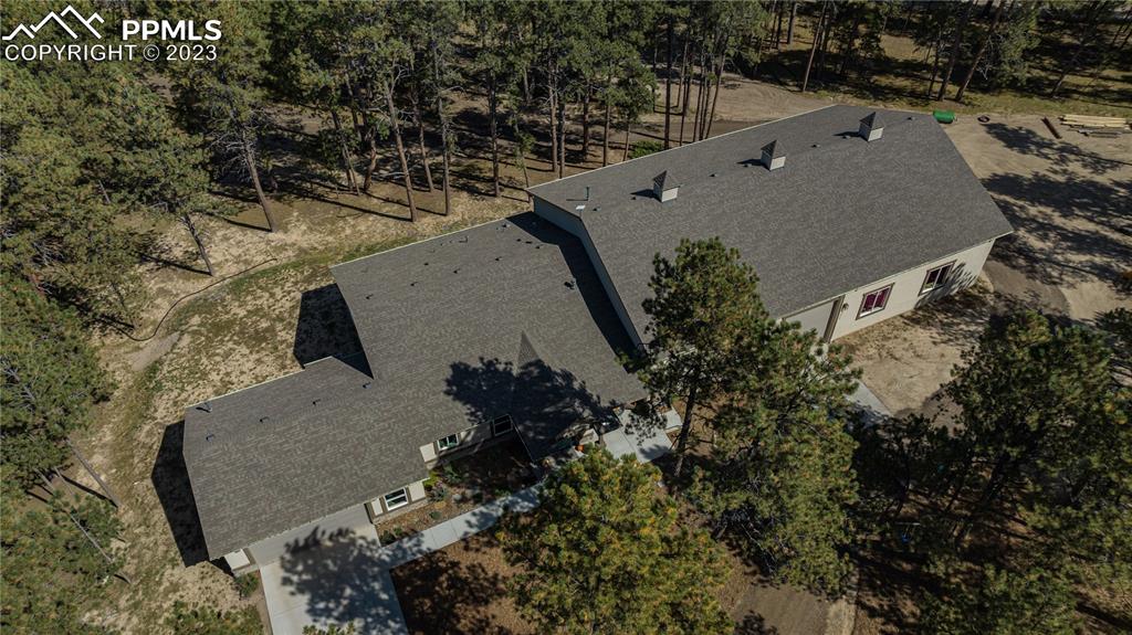 9775 Walker Road Colorado Springs, CO 80908 - Photo 5 of 50 an aerial view of a house with a yard