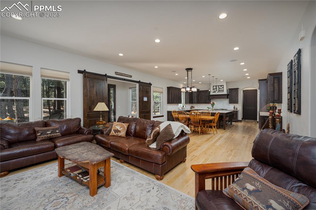 9775 Walker Road Colorado Springs, CO 80908 - Photo 6 of 50 a living room with furniture and kitchen view