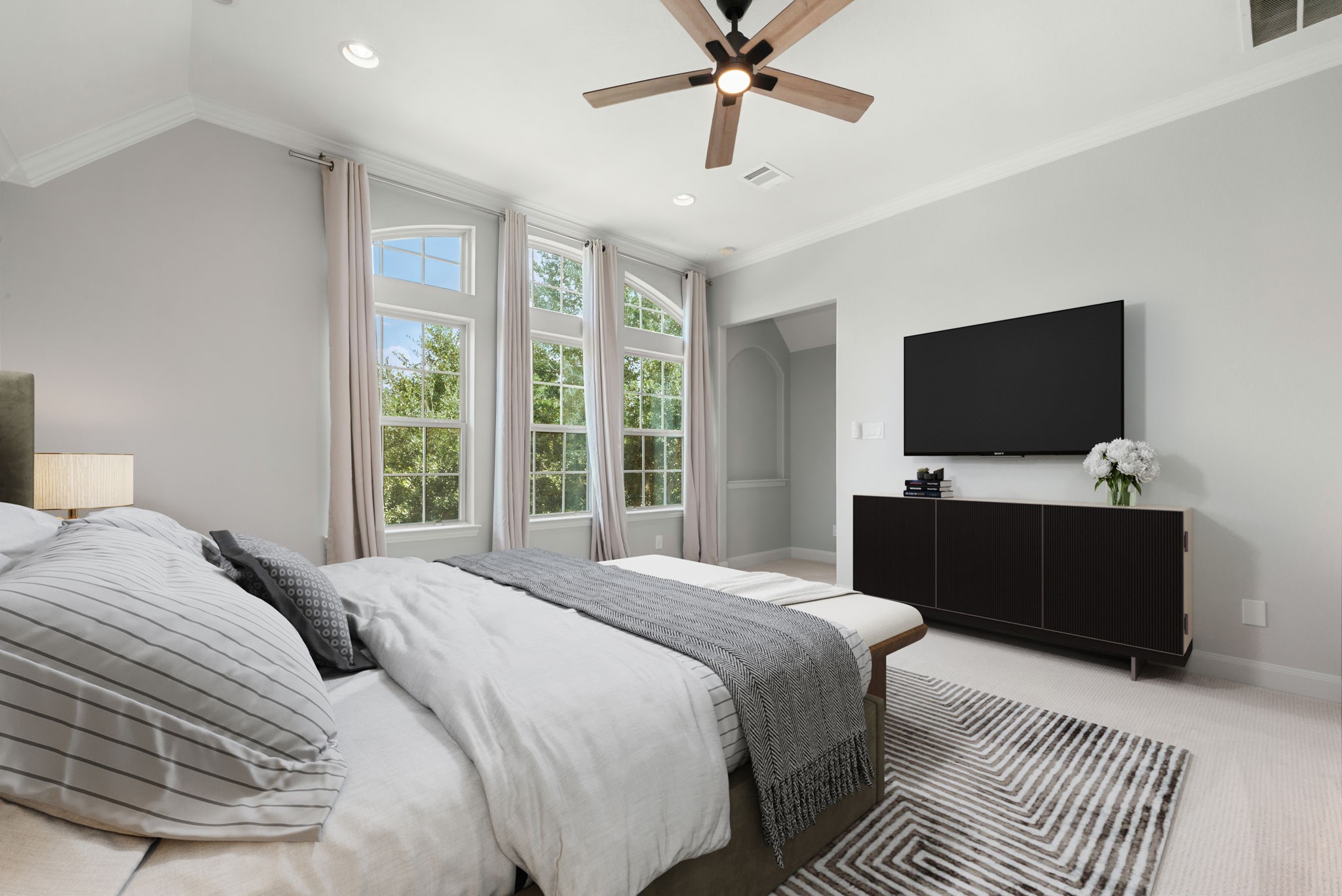 98 Herons Flight Place Spring, TX 77389 - Photo 14 of 29 Serene primary suite with soaring ceilings, arched picture windows, and a spa-like palette, with direct access to the en-suite bath. *Virtually Staged