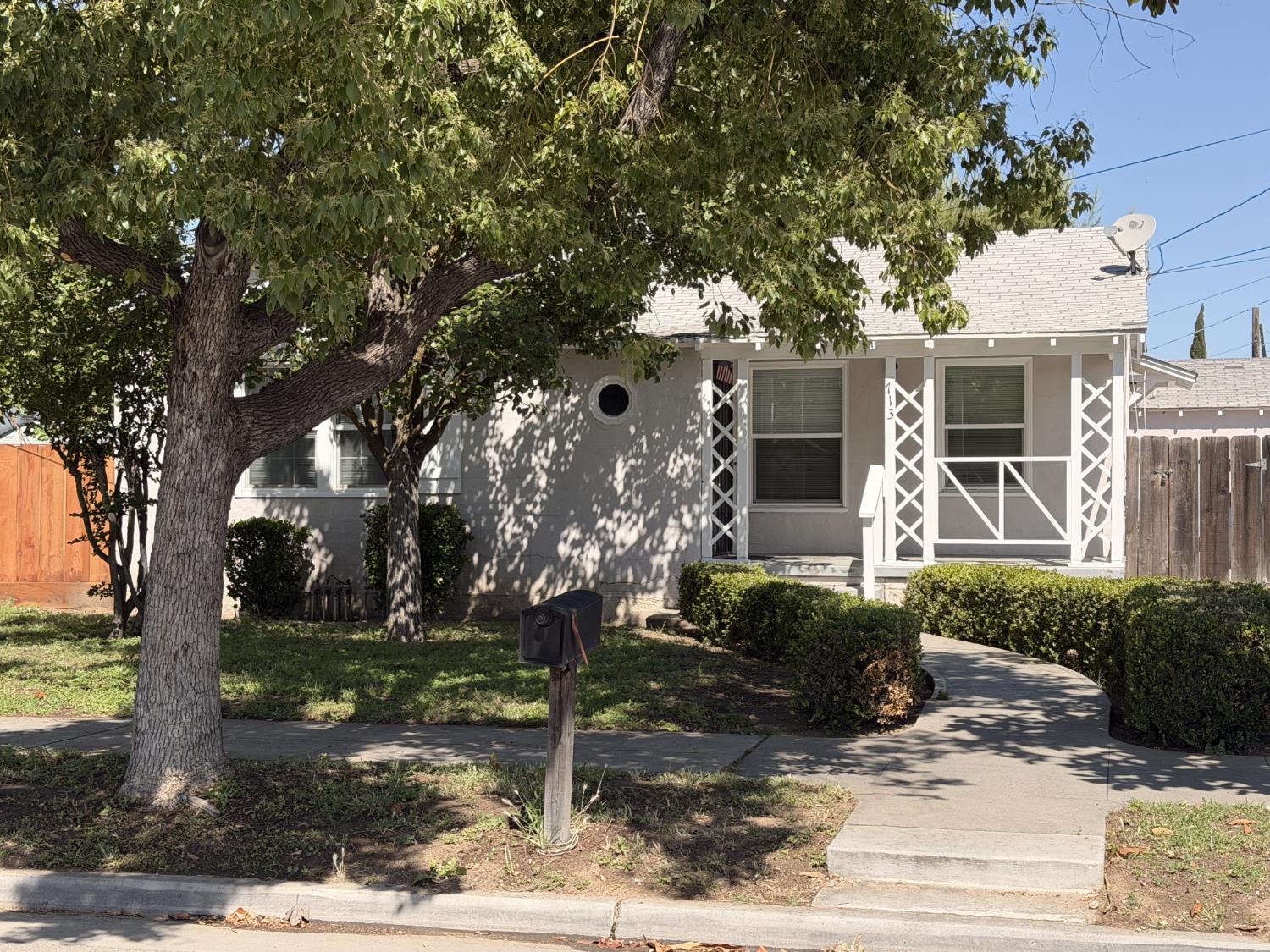 713 West 4th Street Madera, CA 93637 - Photo 2 of 28 a front view of a house with garden