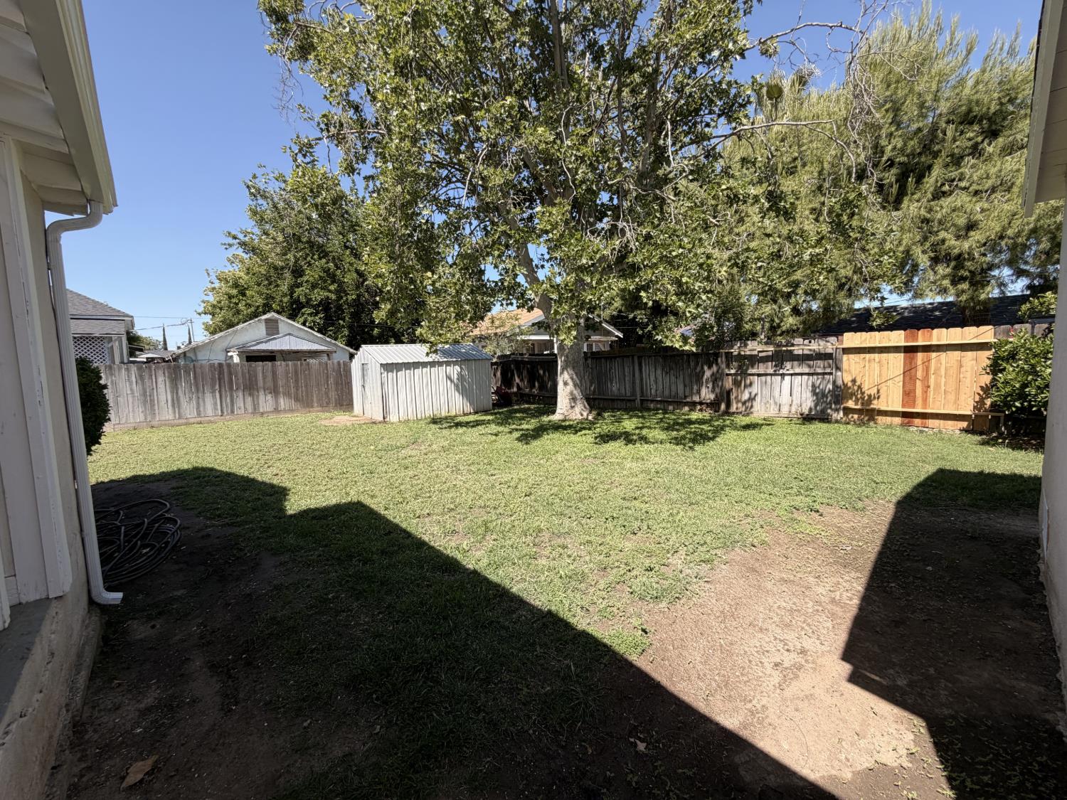 713 West 4th Street Madera, CA 93637 - Photo 24 of 28 a view of a house with backyard