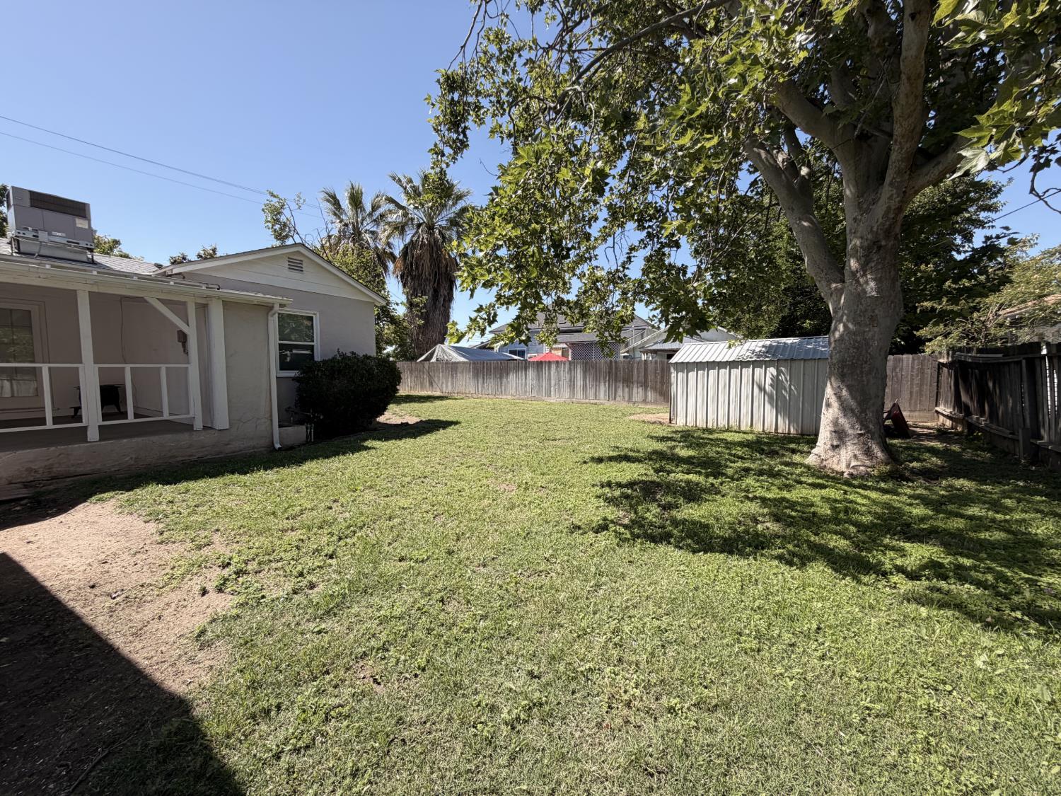 713 West 4th Street Madera, CA 93637 - Photo 25 of 28 a view of a house with a yard