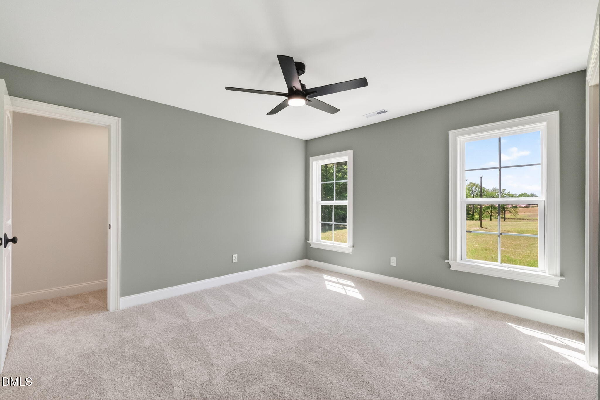 651 Dixon Road, Unit (LOT 2A) Willow Spring, NC 27592 - Photo 59 of 77 a view of a livingroom with a ceiling fan and windows