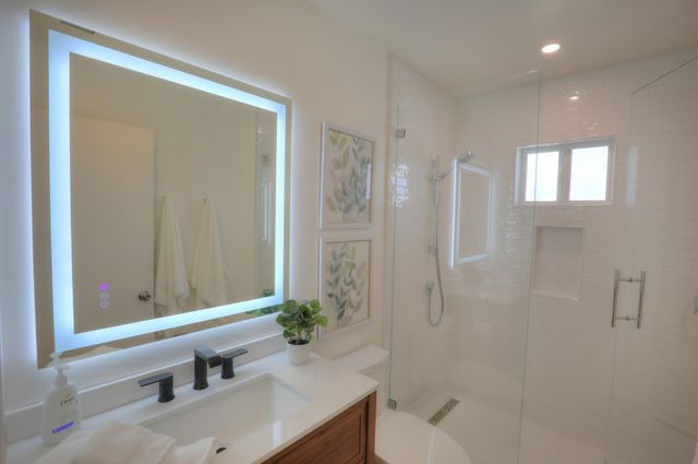a bathroom with a bathtub and a sink