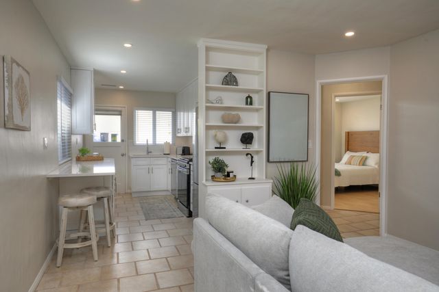a living room with furniture and a large window