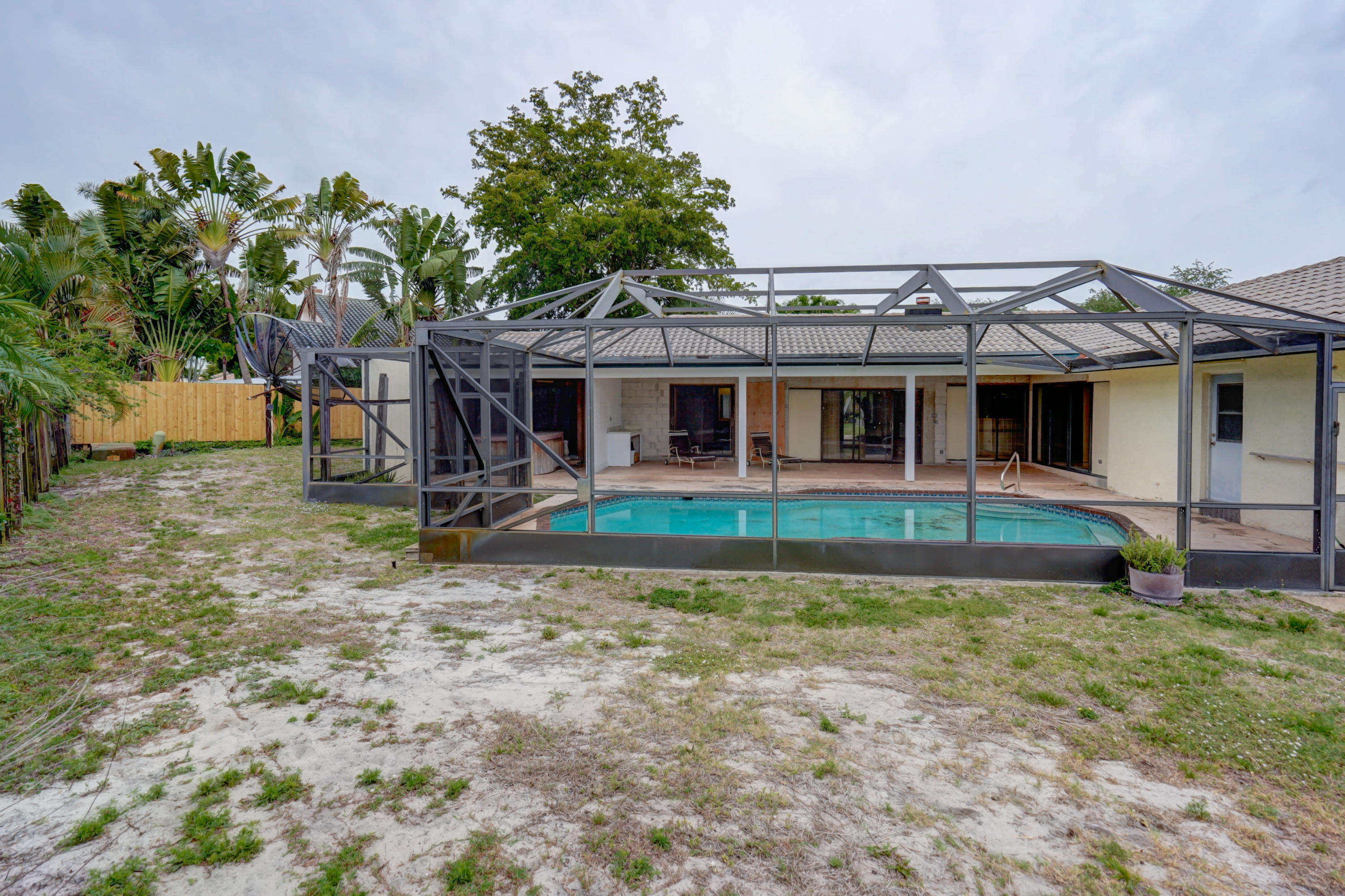 1300 Southwest 2nd Street Boca Raton, FL 33486 - Photo 3 of 18 front view of a house with a yard