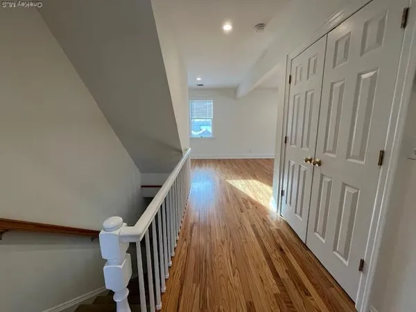 a view of entryway with wooden floor