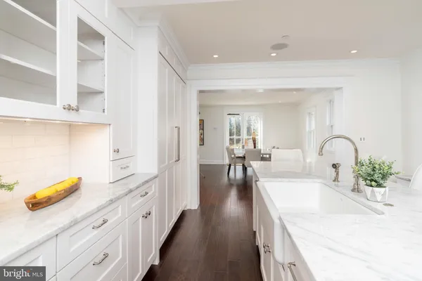 a spacious en suite bathroom with a granite countertop tub and a large mirror