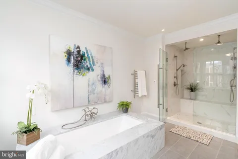 a bathroom with a bathtub and a sink