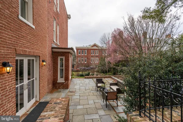 a view of a brick house with many windows