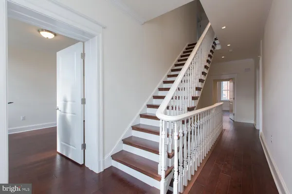 a view of entryway with wooden floor