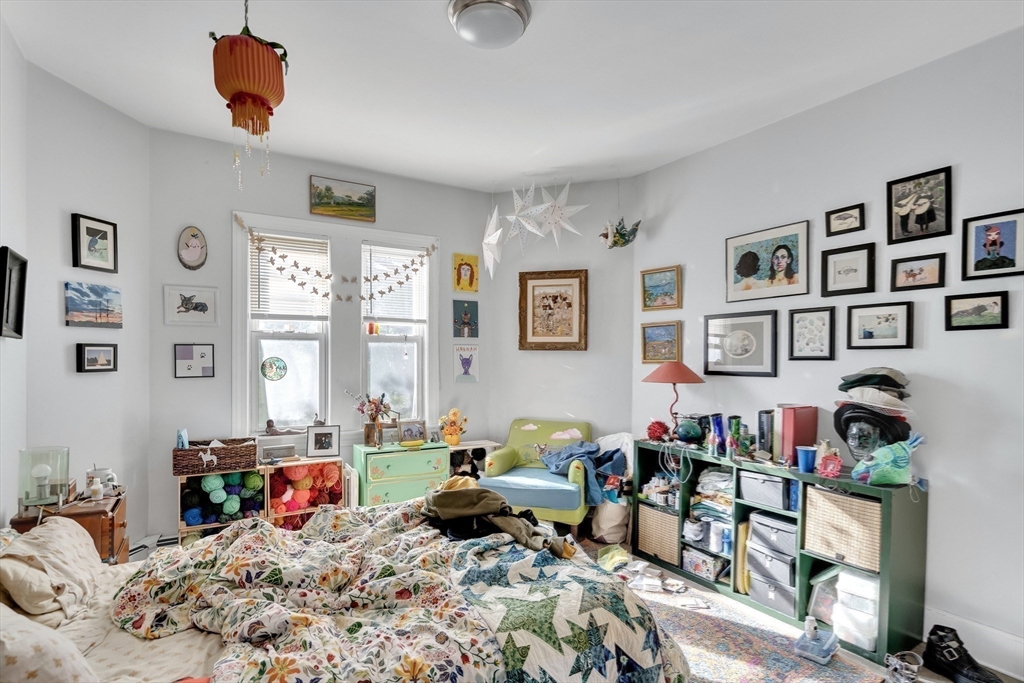 39 Union Street Boston, MA 02135 - Photo 12 of 27 a bedroom with furniture a rug and a window