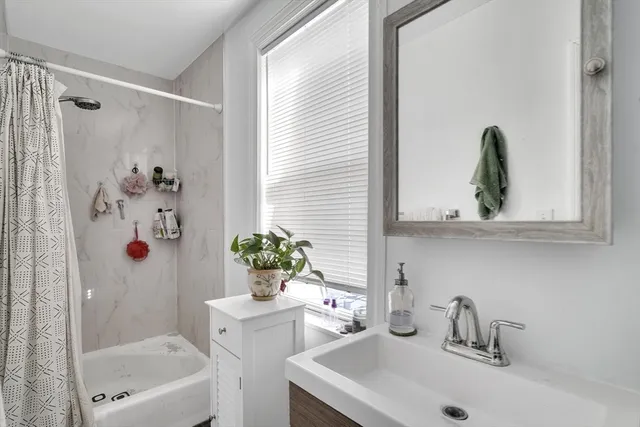 a bathroom with a sink a toilet and a bathtub