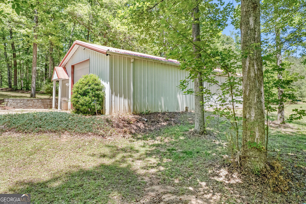 230 Haynes Road Moreland, GA 30259 - Photo 33 of 38 a view of a house with a yard and plants