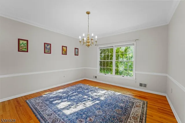 a view of a room with window and rug