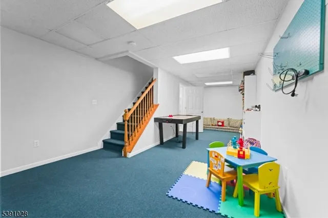 a room with musical instruments and stairs
