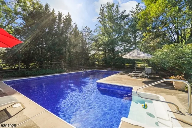 a view of a backyard with sitting area