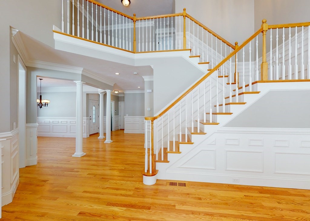 80 Clubhouse Way, Unit 80 Sutton, MA 01590 - Photo 2 of 29 a view of staircase with white walls and a rug