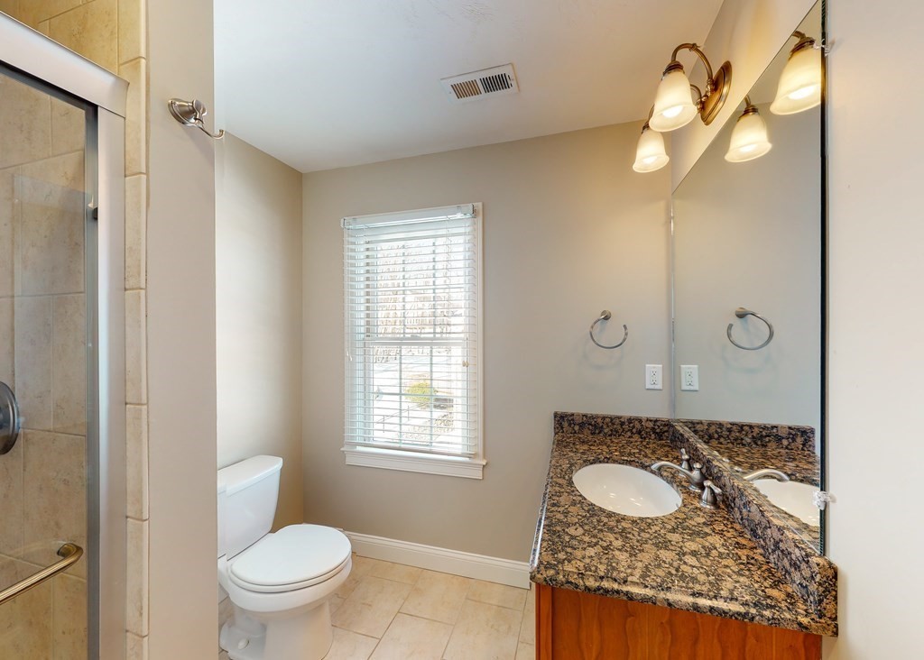 80 Clubhouse Way, Unit 80 Sutton, MA 01590 - Photo 21 of 29 a bathroom with a sink and a mirror