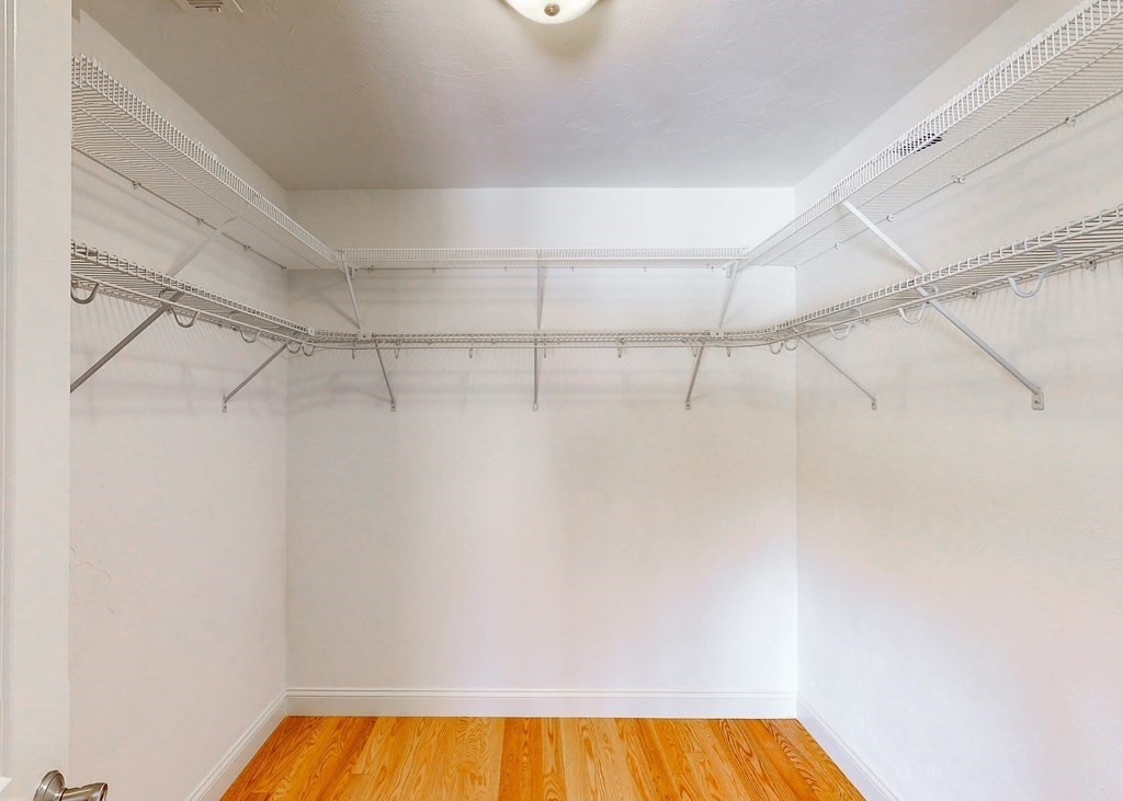 80 Clubhouse Way, Unit 80 Sutton, MA 01590 - Photo 24 of 29 a view of a room with racks on the wall