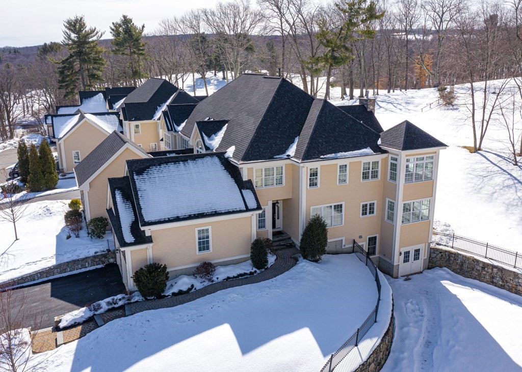 80 Clubhouse Way, Unit 80 Sutton, MA 01590 - Photo 26 of 29 a aerial view of a house with table and chairs