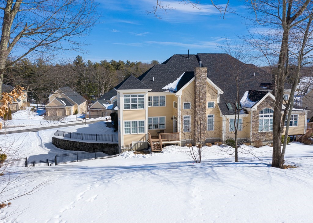 80 Clubhouse Way, Unit 80 Sutton, MA 01590 - Photo 27 of 29 a front view of a house with a yard