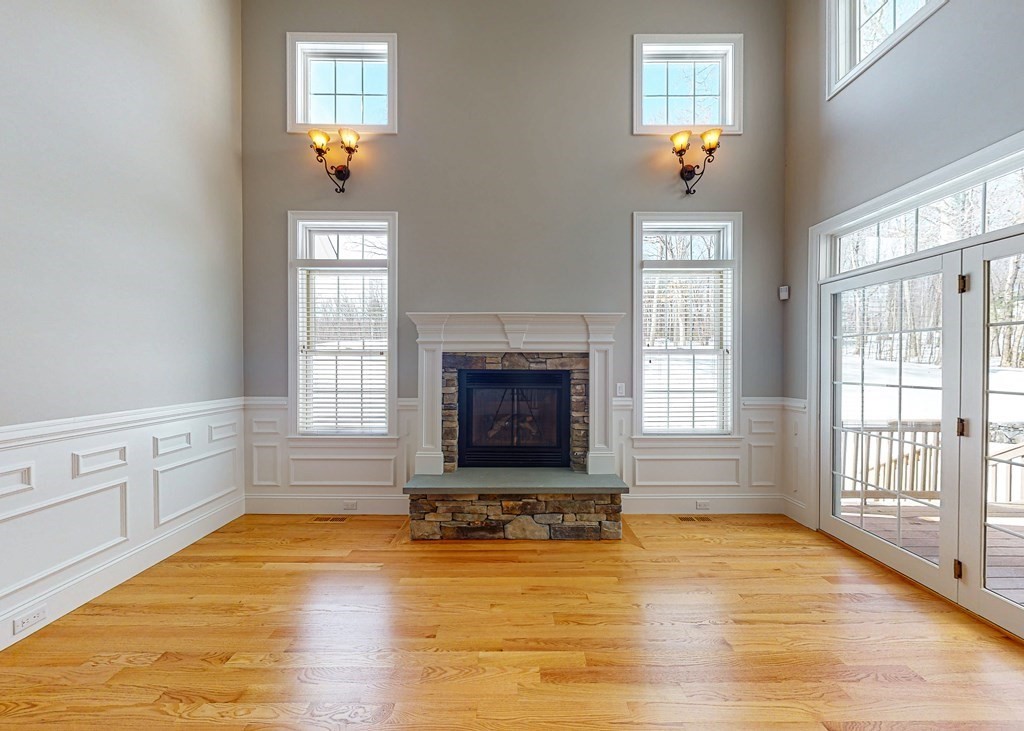 80 Clubhouse Way, Unit 80 Sutton, MA 01590 - Photo 3 of 29 a living room with hardwood flooring and a fireplace