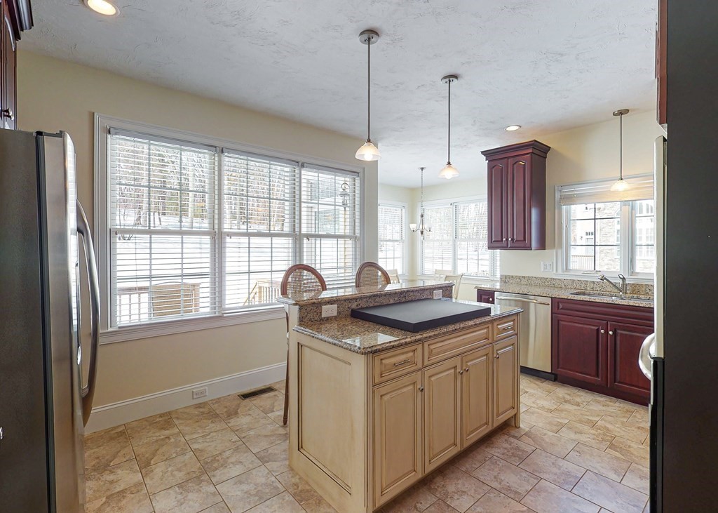 80 Clubhouse Way, Unit 80 Sutton, MA 01590 - Photo 6 of 29 a kitchen with a stove sink and window