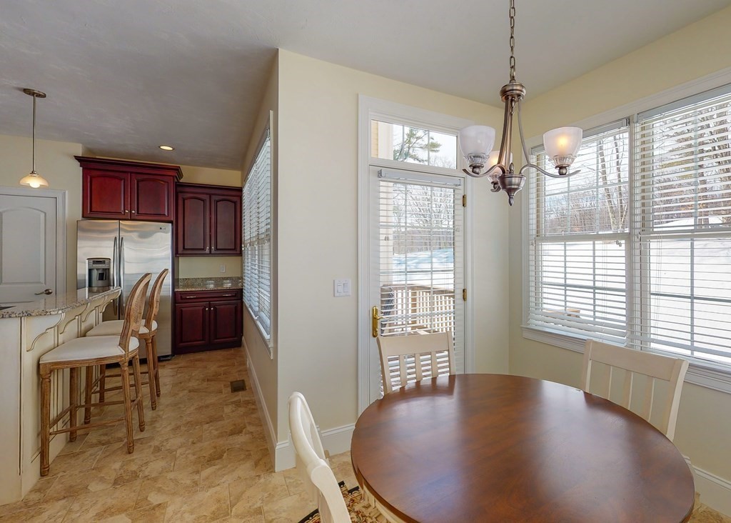 80 Clubhouse Way, Unit 80 Sutton, MA 01590 - Photo 9 of 29 a view of a livingroom with furniture window and wooden floor