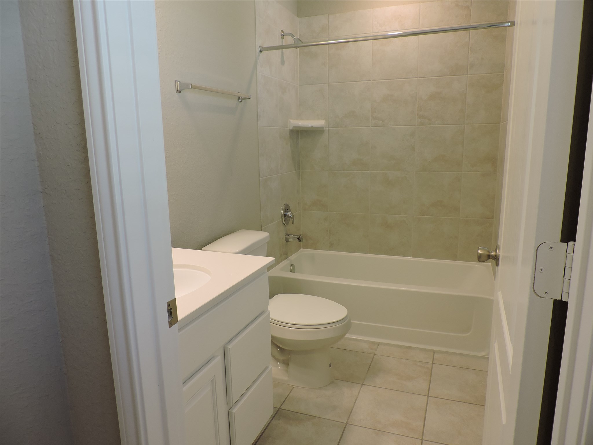 1102 Upton Court Conroe, TX 77304 - Photo 19 of 30 a bathroom with a granite countertop sink toilet and shower
