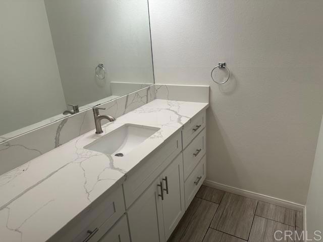 527 South Sierra Avenue, Unit 185 Solana Beach, CA 92075 - Photo 16 of 30 a bathroom with a sink and mirror