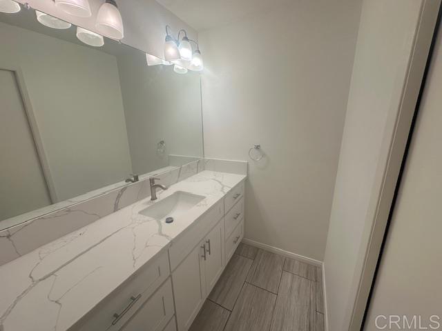 527 South Sierra Avenue, Unit 185 Solana Beach, CA 92075 - Photo 17 of 30 a bathroom with a double vanity sink and a mirror