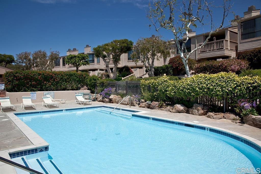527 South Sierra Avenue, Unit 185 Solana Beach, CA 92075 - Photo 18 of 30 a view of a swimming pool and a chairs