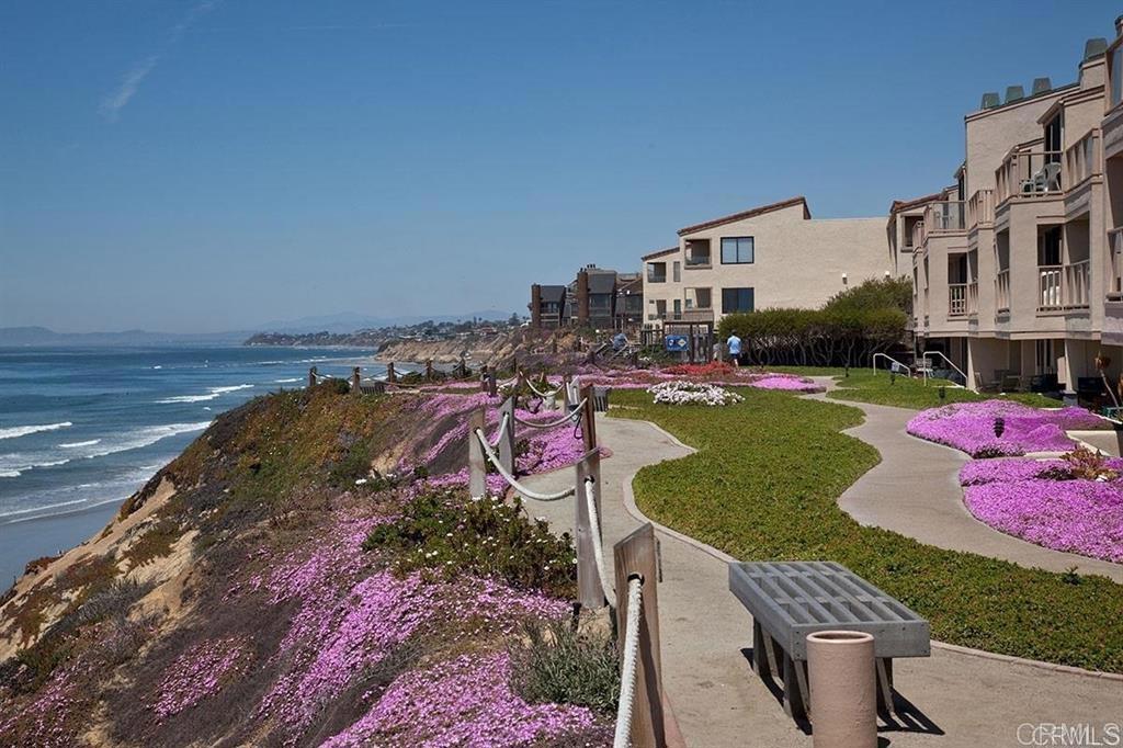 527 South Sierra Avenue, Unit 185 Solana Beach, CA 92075 - Photo 2 of 30 a view of a swimming pool with a yard