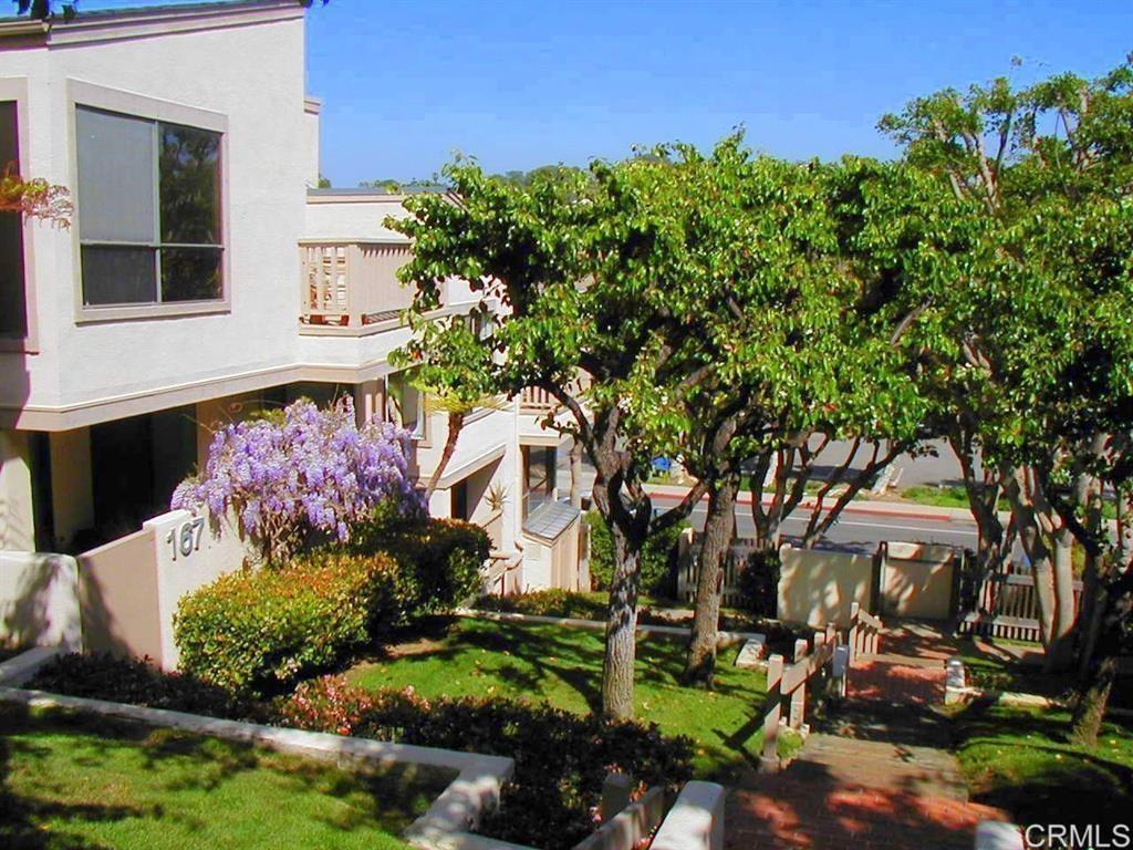 527 South Sierra Avenue, Unit 185 Solana Beach, CA 92075 - Photo 3 of 30 a front view of a house with a yard