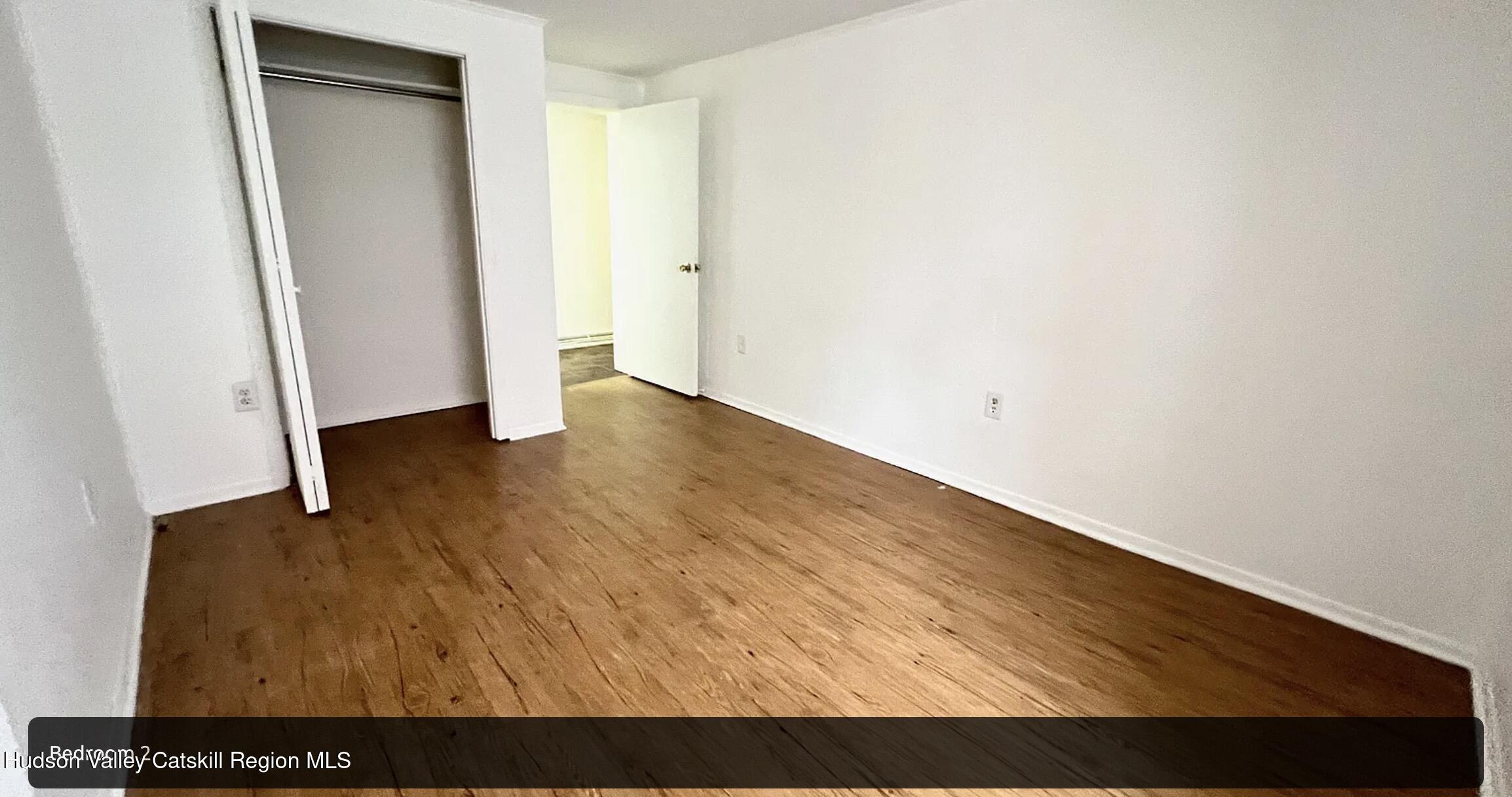 602 Columbia Street, Unit 1 Hudson, NY 12534 - Photo 11 of 19 a view of an empty room with wooden floor
