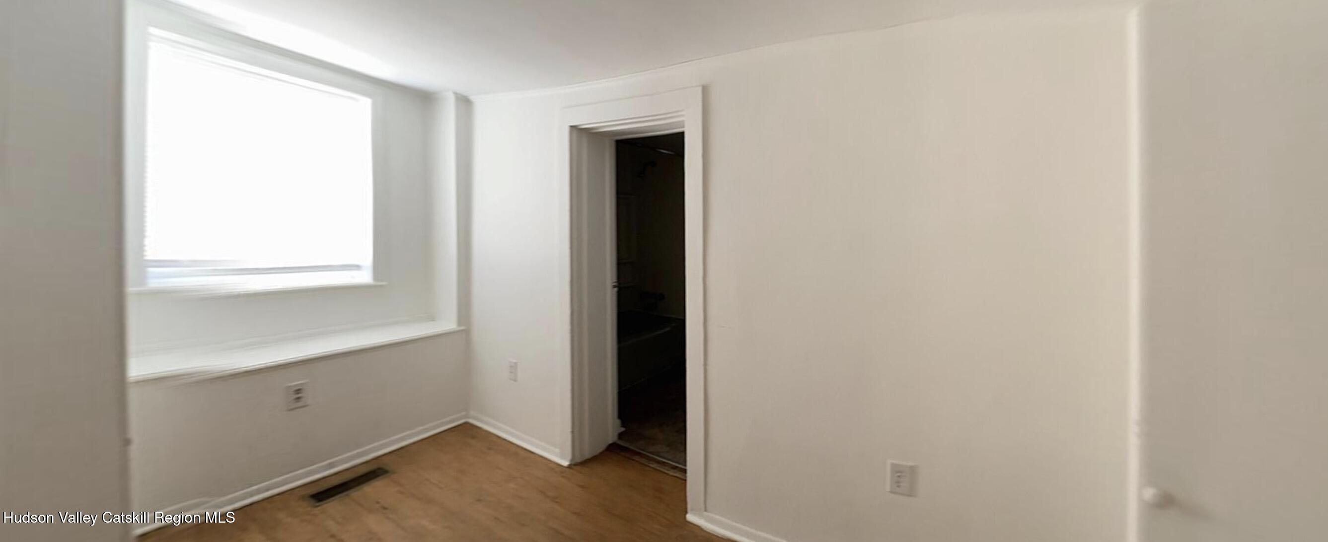 602 Columbia Street, Unit 1 Hudson, NY 12534 - Photo 12 of 19 a view of an empty room and window