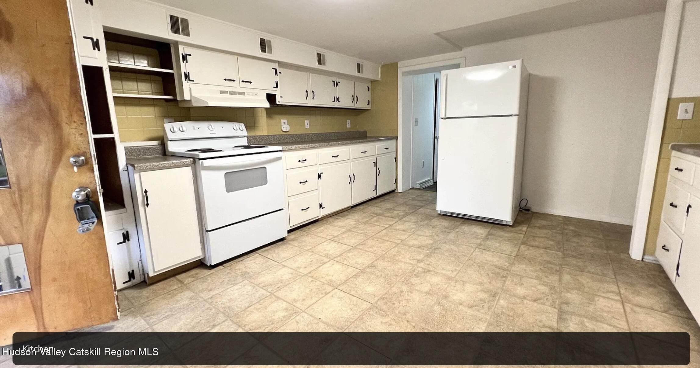 602 Columbia Street, Unit 1 Hudson, NY 12534 - Photo 14 of 19 a kitchen with stainless steel appliances a refrigerator sink and cabinets