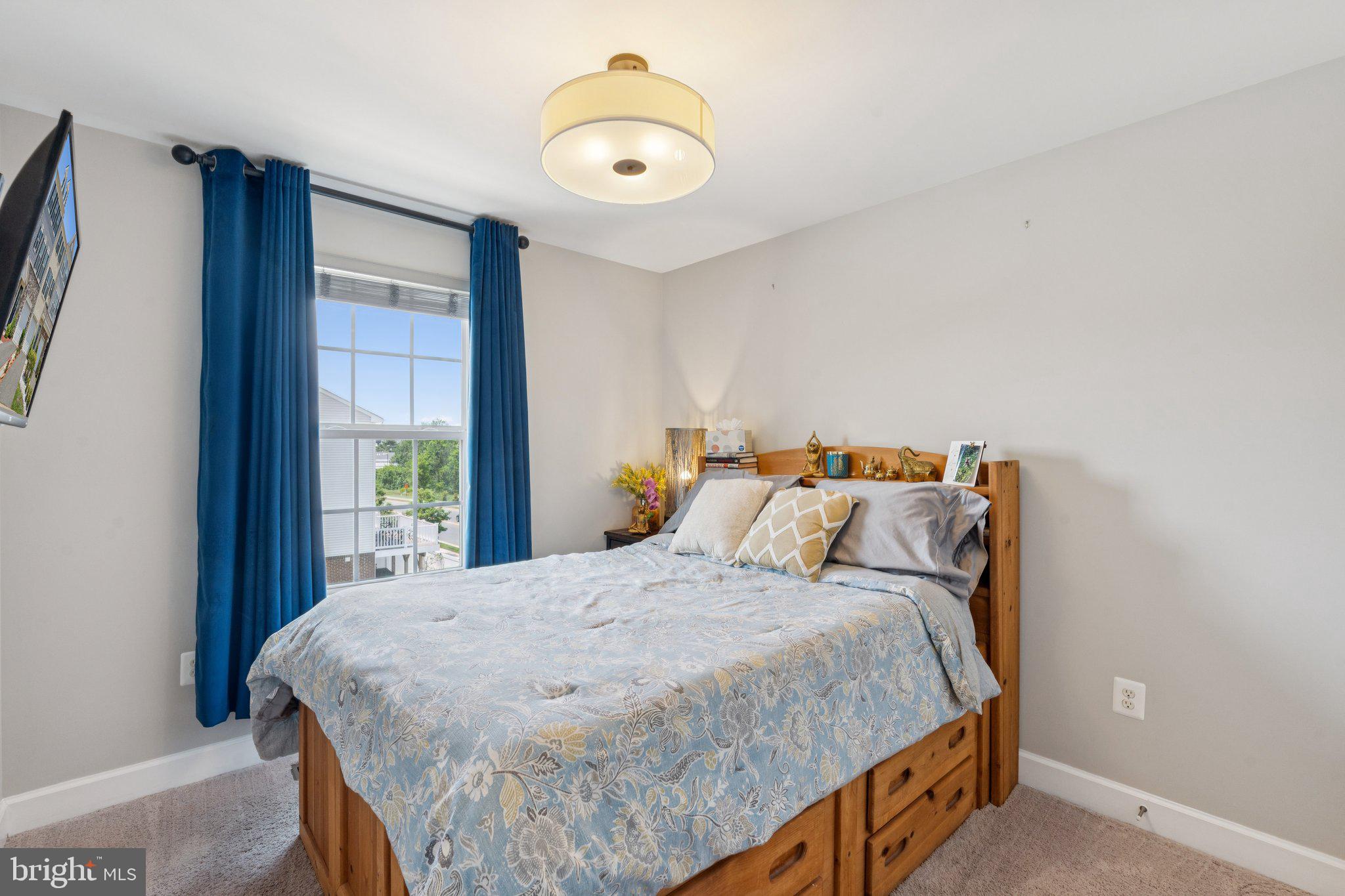9924 Whitemoss Drive Manassas, VA 20109 - Photo 22 of 43 a bed sitting in a bedroom next to a window