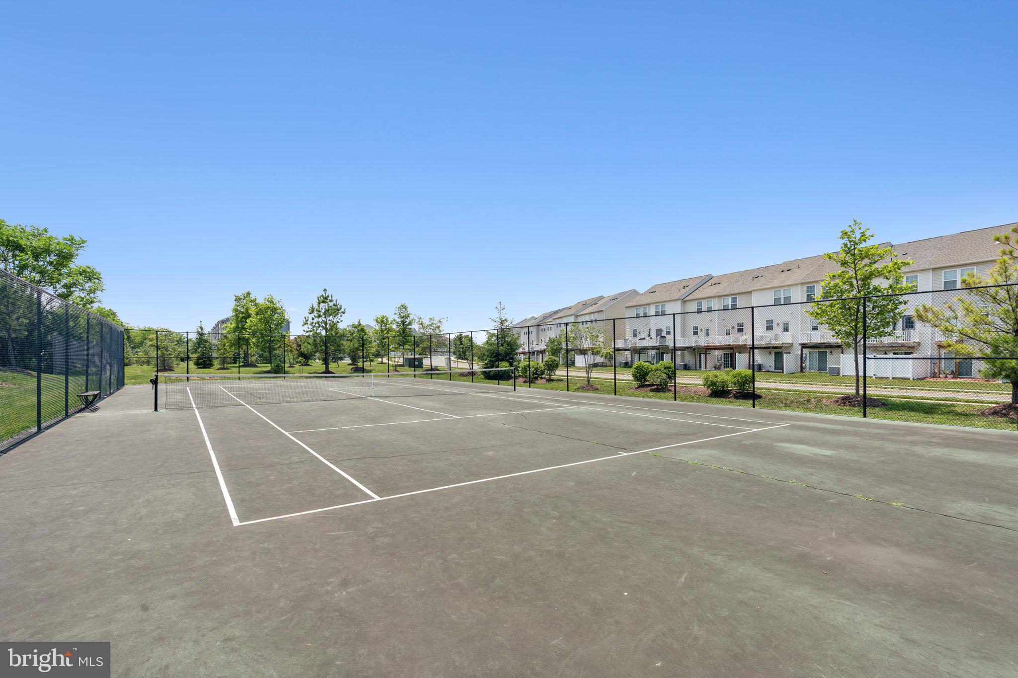 9924 Whitemoss Drive Manassas, VA 20109 - Photo 37 of 43 a view of a tennis ground with large trees