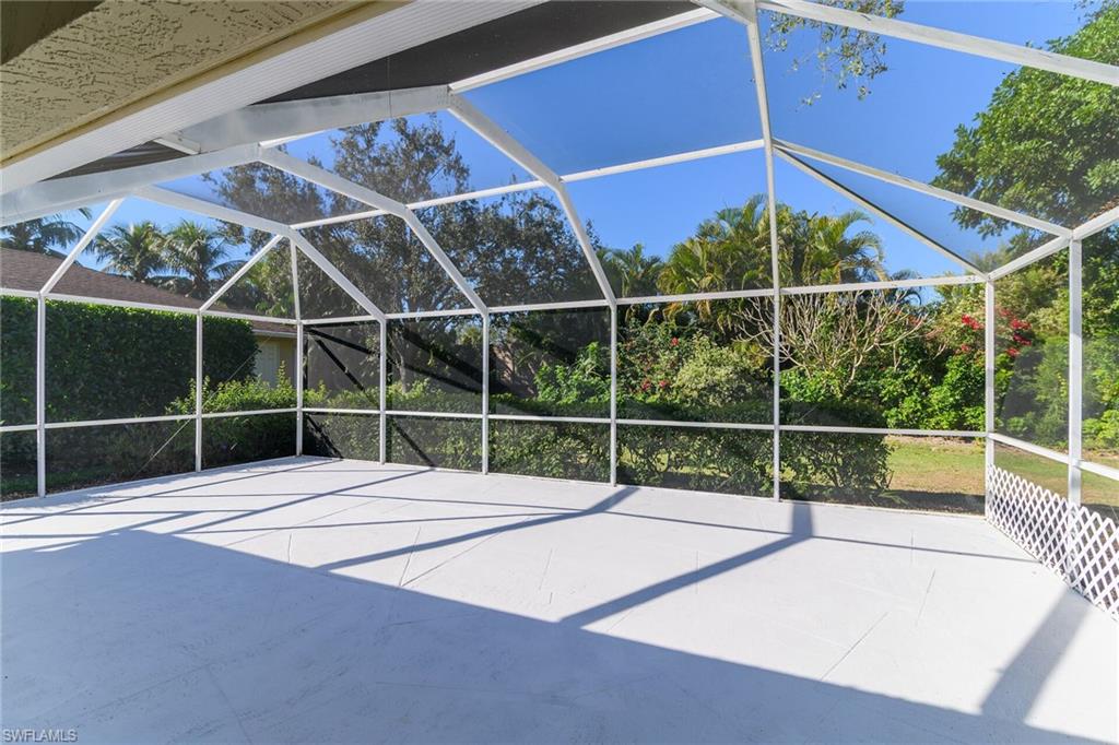 789 Coldstream Court Naples, FL 34104 - Photo 24 of 26 a view of a room with a window and wooden floor